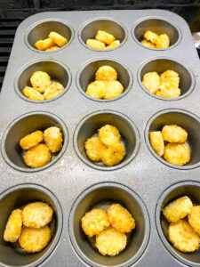 A muffin pan with hash browns. Cooking With Fudge