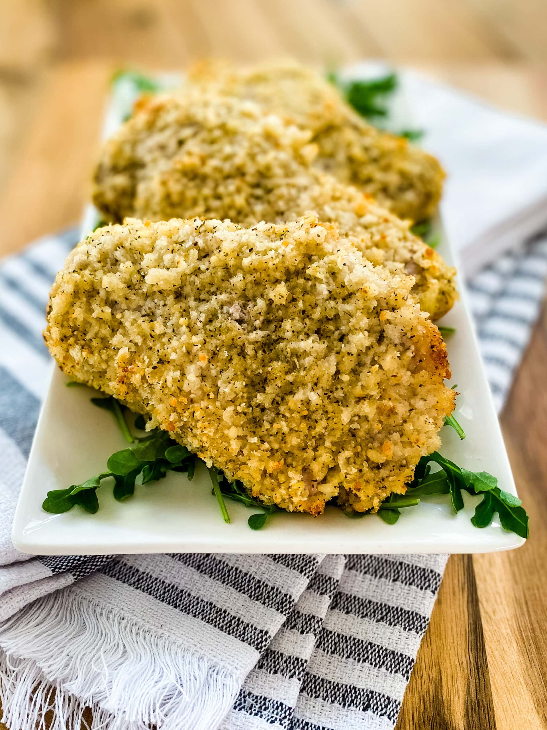 Plate with Parmesan Crusted Pork Chops. Cooking With Fudge